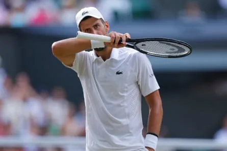 Novak Djokovic of Serbia reacts during his men's singles semi-final against Jannik Sinner of Italy.